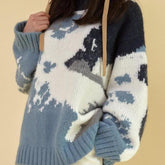 Blauer Himmel und weiße Wolken Lockerer Wollstrickpullover